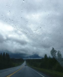 Road against sky during rainy season
