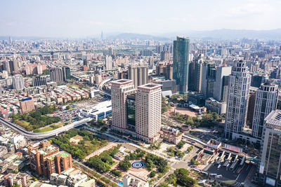 High angle view of modern buildings in city against sky