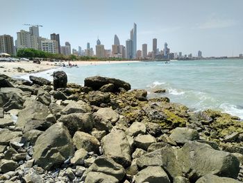 Scenic view of sea and buildings against sky