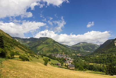 Scenic view of landscape and mountains against sky