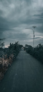 Road by street against sky during winter