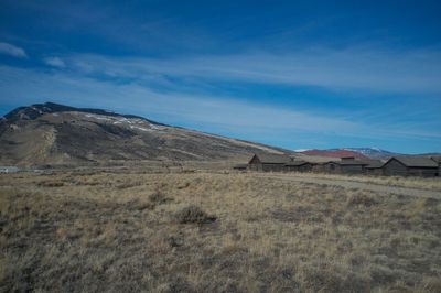 Scenic view of landscape against cloudy sky