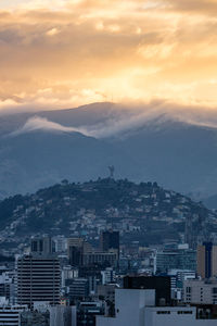 Cityscape against sky during sunset