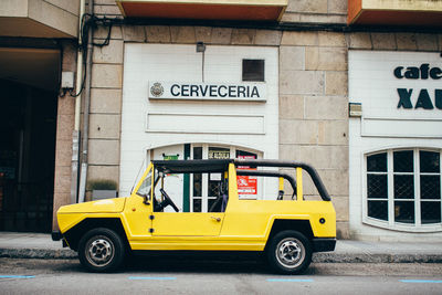 Vintage car parked in front of building