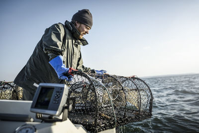 Fisherman with lobster trap