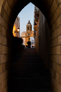 Alley amidst buildings in city