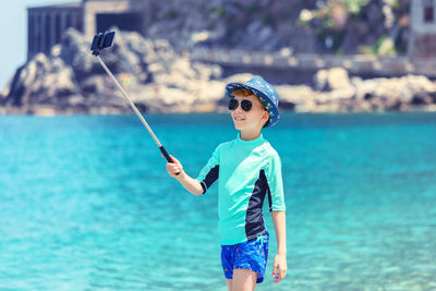 Boy standing in sea