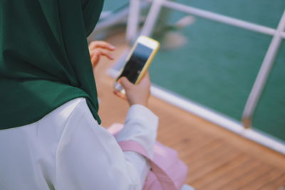 Close-up of hand holding smart phone