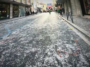 Surface level of road amidst buildings in city