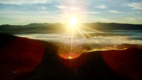 Scenic view of mountains against sky during sunset