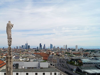 Modern buildings in city against sky