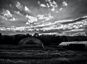 Built structure on field against sky