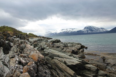 Scenic view of mountains against cloudy sky