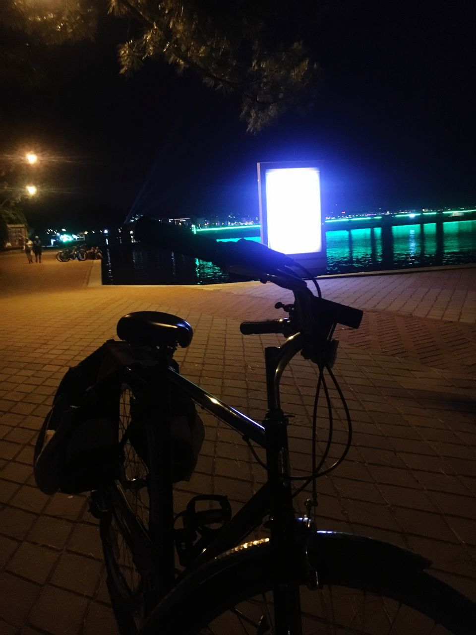 illuminated, night, city, bicycle, street, transportation, mode of transportation, land vehicle, no people, architecture, technology, lighting equipment, building exterior, stationary, built structure, nature, outdoors, light - natural phenomenon, sky, parking, light