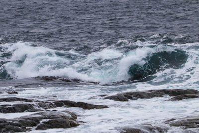 View of waves splashing on rocks