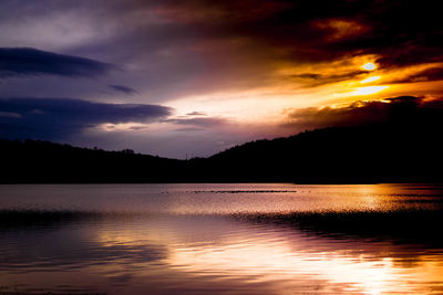 Scenic view of lake against sky during sunset