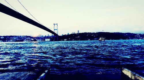 Bridge over sea against sky