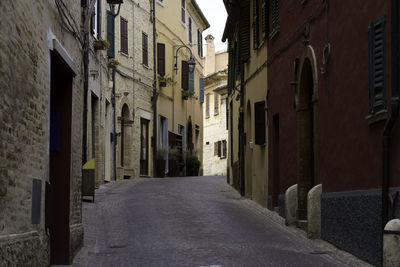 Narrow alley amidst buildings in city