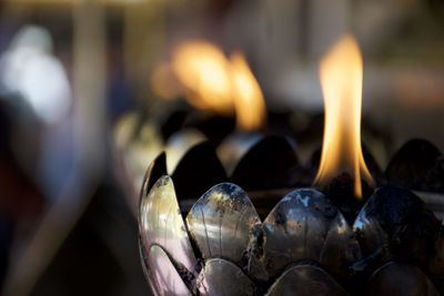 Close-up of illuminated diya