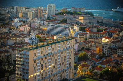 High angle view of city lit up at dusk