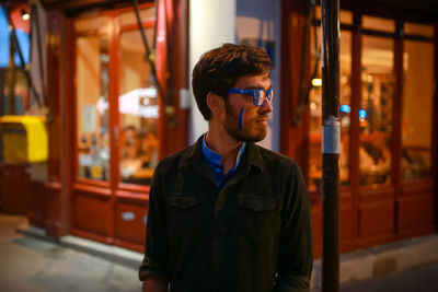 Portrait of young man looking away