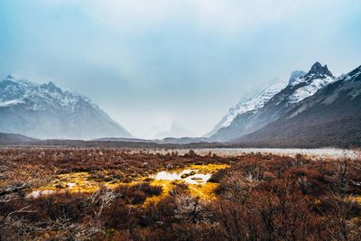 Scenic view of snowcapped mountains against sky