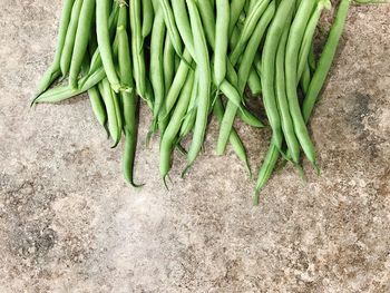 High angle view of green chili peppers