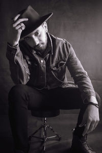 Portrait of a young man sitting outdoors