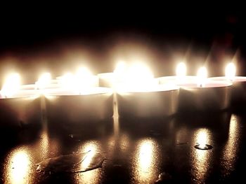 Close-up of lit tea light candles