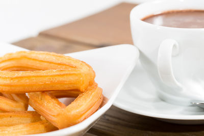 Close-up of coffee cup on table