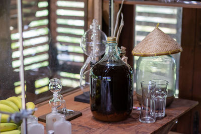 Close-up of glass bottles on table