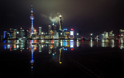 Illuminated buildings in city at night