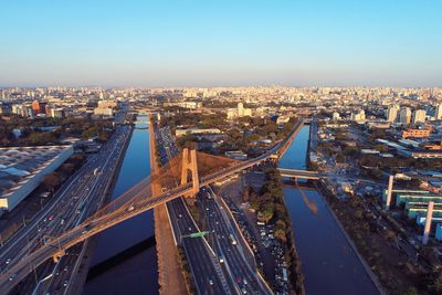 High angle view of bridge and buildings against sky