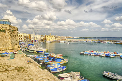 Boats moored at harbor