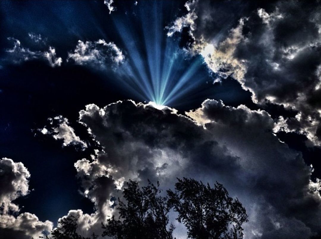 cloud - sky, low angle view, sky, outdoors, scenics, beauty in nature, sunbeam, tree, nature, no people