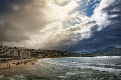 Scenic view of beach against sky in city