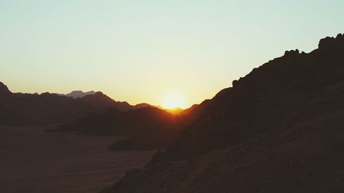 Scenic view of mountains at sunset