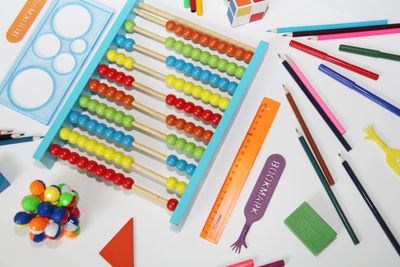 Directly above shot of school supplies over white background