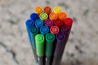 Close-up of multi colored pencils on table