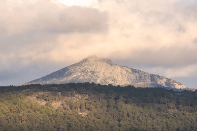 Scenic view of volcanic mountain against sky