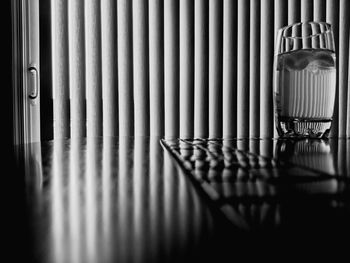 Close-up of metal grate on table