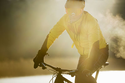 Man cycling on a frozen lake