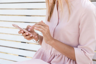 Midsection of woman holding hands