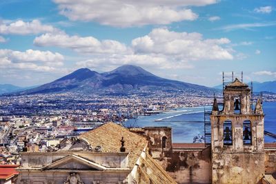 View of town against cloudy sky