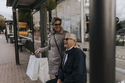 Senior couple waiting at bus stop