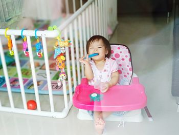 Cute girl sitting with toy