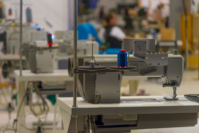 Close-up of sewing machine at industry