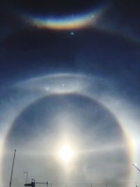 Low angle view of sun in sky