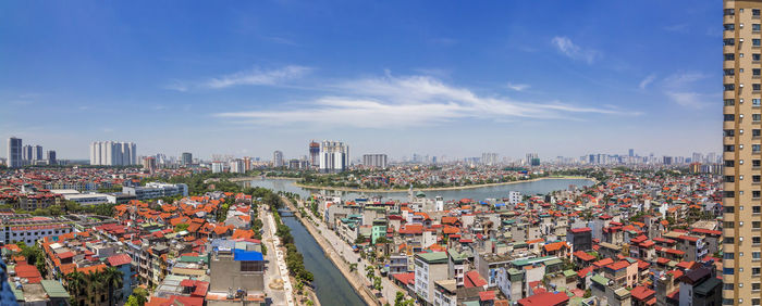 High angle view of city buildings against sky