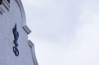 Low angle view of chain against sky